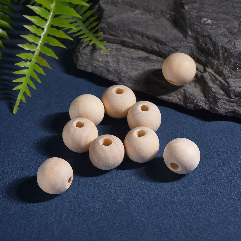Perle en bois naturel, boule, diamètre 14mm, trou env. 3 mm, l'unité