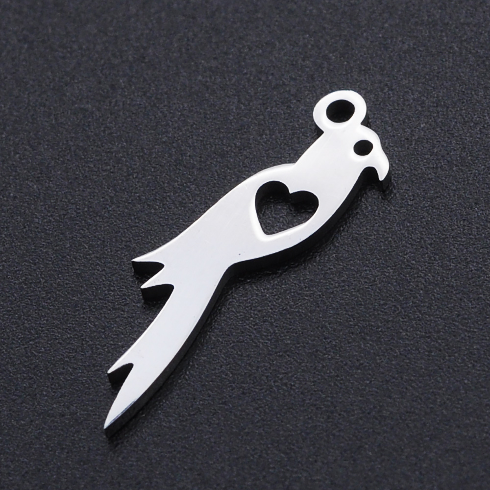 Pendentif INOX argenté, oiseau avec coeur, 25x7x1mm trou 1.5mm