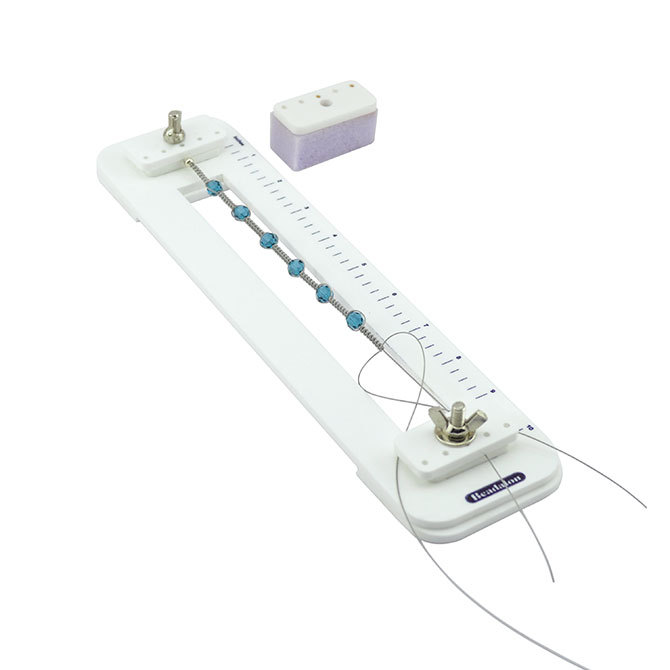 Outil à nouer blanc en plastique, 31x7,5 cm