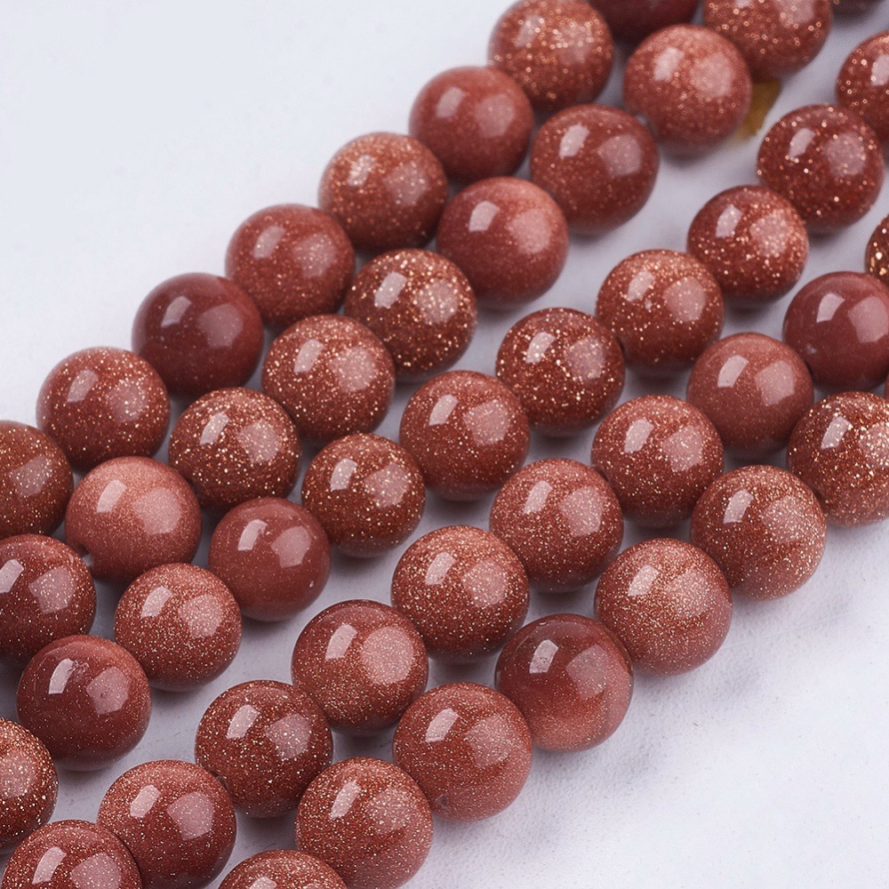 Pierre de Soleil synthétique brun ronde 6mm trou 1mm