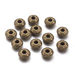 Perle laiton or antique, couleur bronze, forme toupie motif floral, 10,5x7,5mm, trou 1mm, l'unité